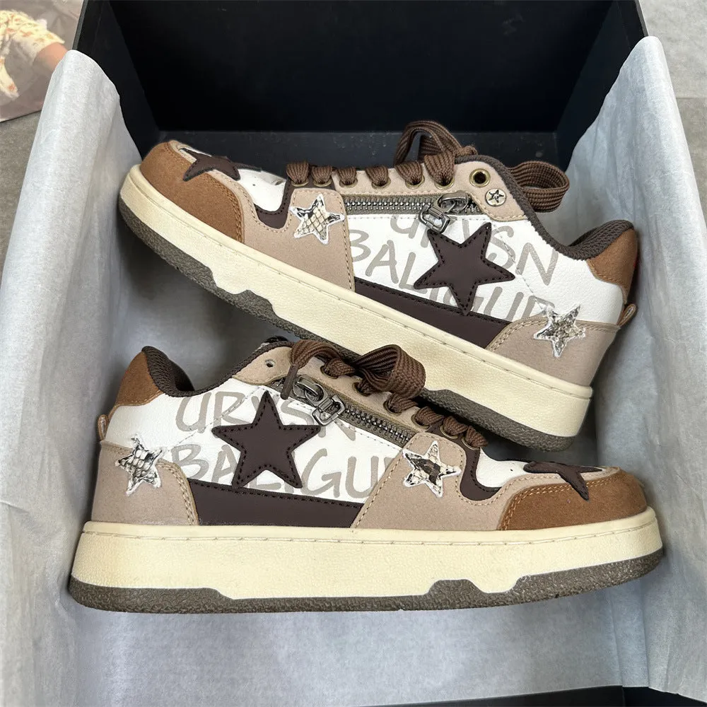 Brown candy colour low-top sneakers with rubber sole and lace-up front on a neutral background