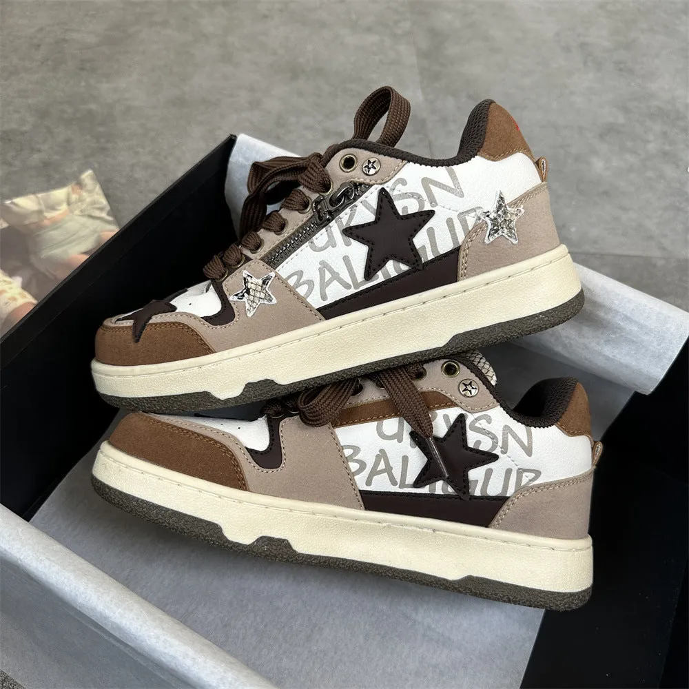 Brown candy colour low-top sneakers with rubber sole and lace-up front on a neutral background