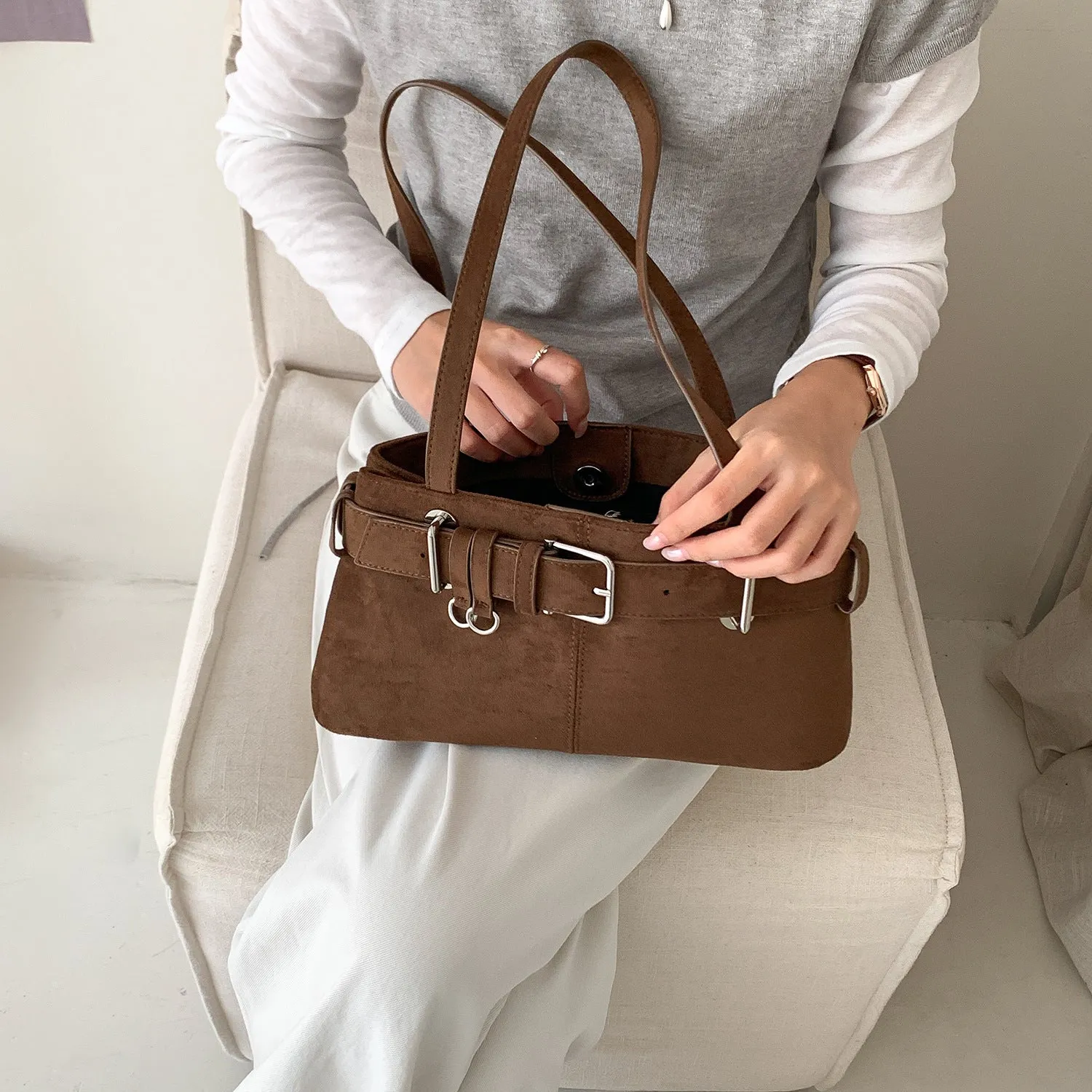 Retro minority design underarm bag in apricot colour with horizontal square shape and double shoulder straps.