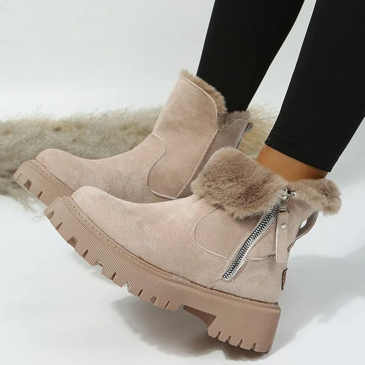 Women's black snow boots with foldable plush tube, suede upper, and rubber sole on winter pavement