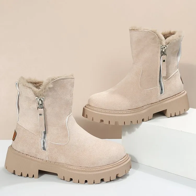 Women's black snow boots with foldable plush tube, suede upper, and rubber sole on winter pavement