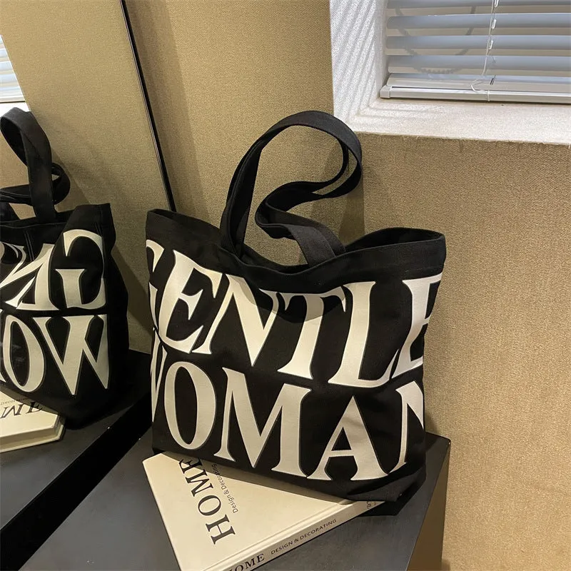 Large capacity canvas tote bag with letter print and upgraded zipper, off-white colour, on plain background