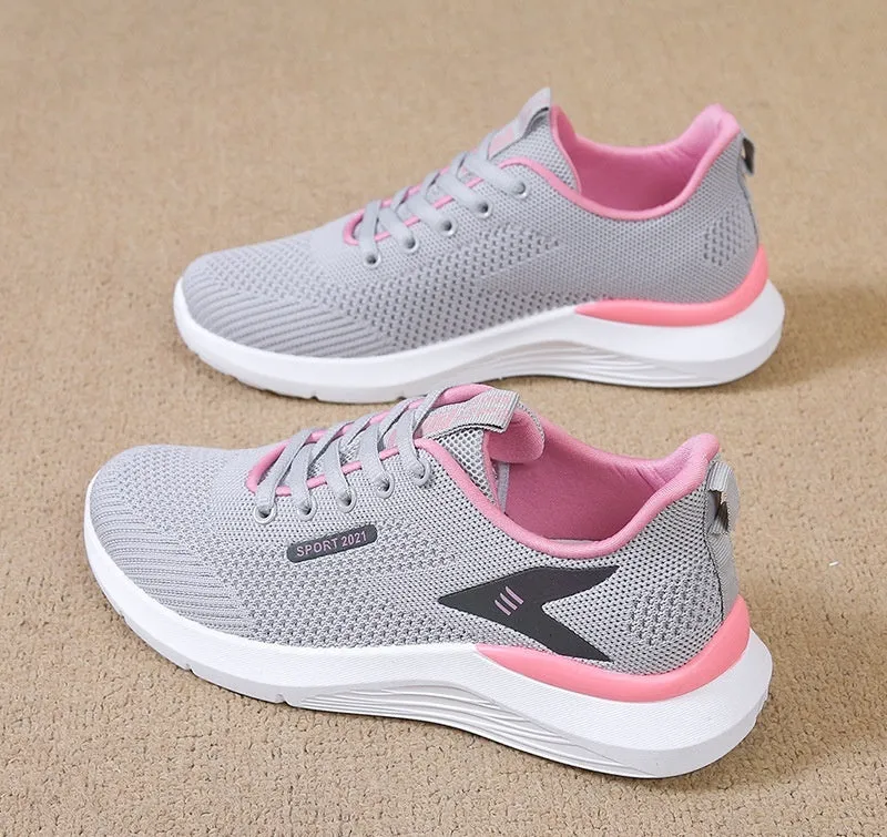 Low-top women's casual running shoes in beige with mesh upper, round toe, and front lace-up closure