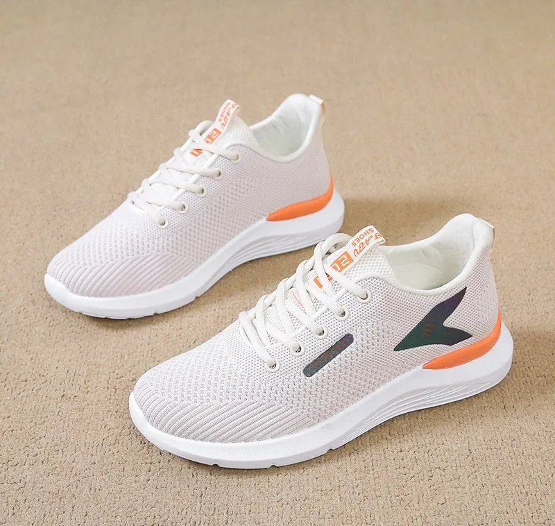 Low-top women's casual running shoes in beige with mesh upper, round toe, and front lace-up closure