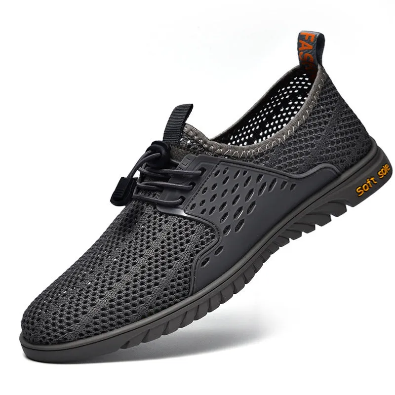 Men's black mesh casual sneaker with elastic band and rubber sole on a light background.