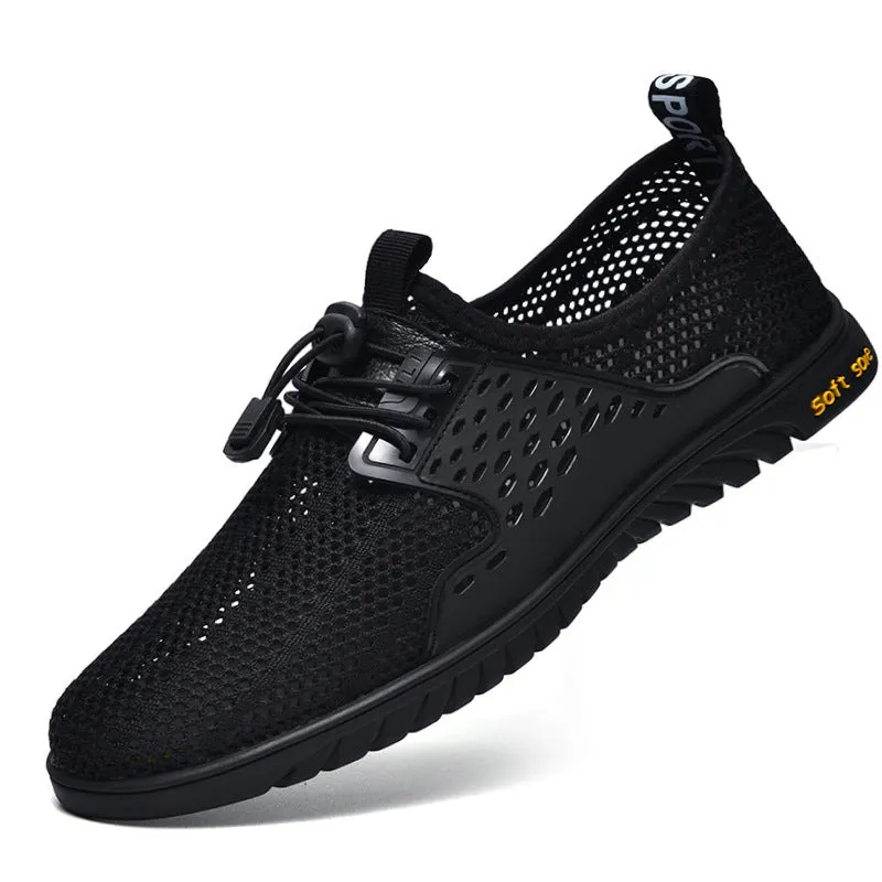 Men's black mesh casual sneaker with elastic band and rubber sole on a light background.