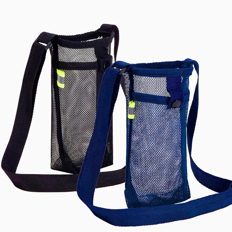 Nylon water bottle holder in black with adjustable shoulder strap on a beach setting