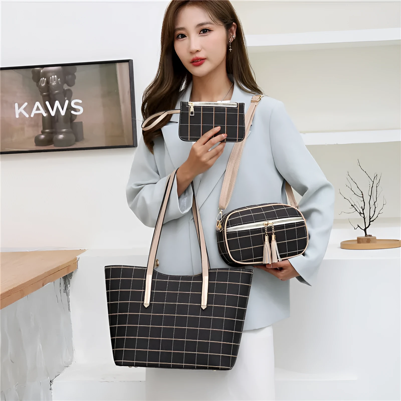 Korean fashion four-piece bag set in black with cartoon anime pattern and sewing thread detail on cross square PU tote bag