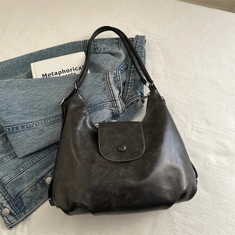 Textured PU leather women's single strap shoulder bag in a horizontal square shape, shown in black colour.