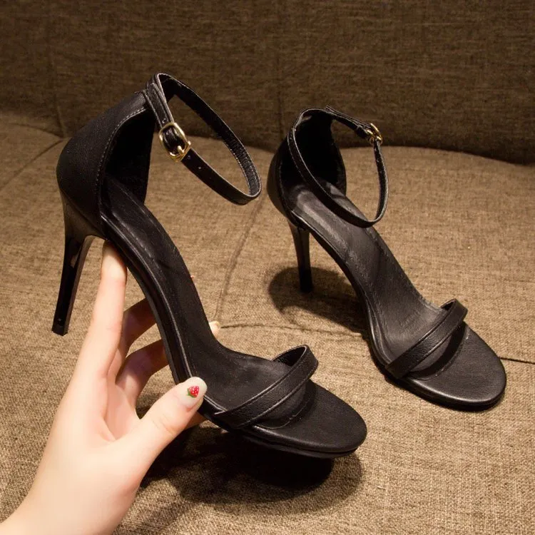 Strap stiletto heels in black with 7cm heel, adjustable ankle strap, premium fabric upper, and rubber sole