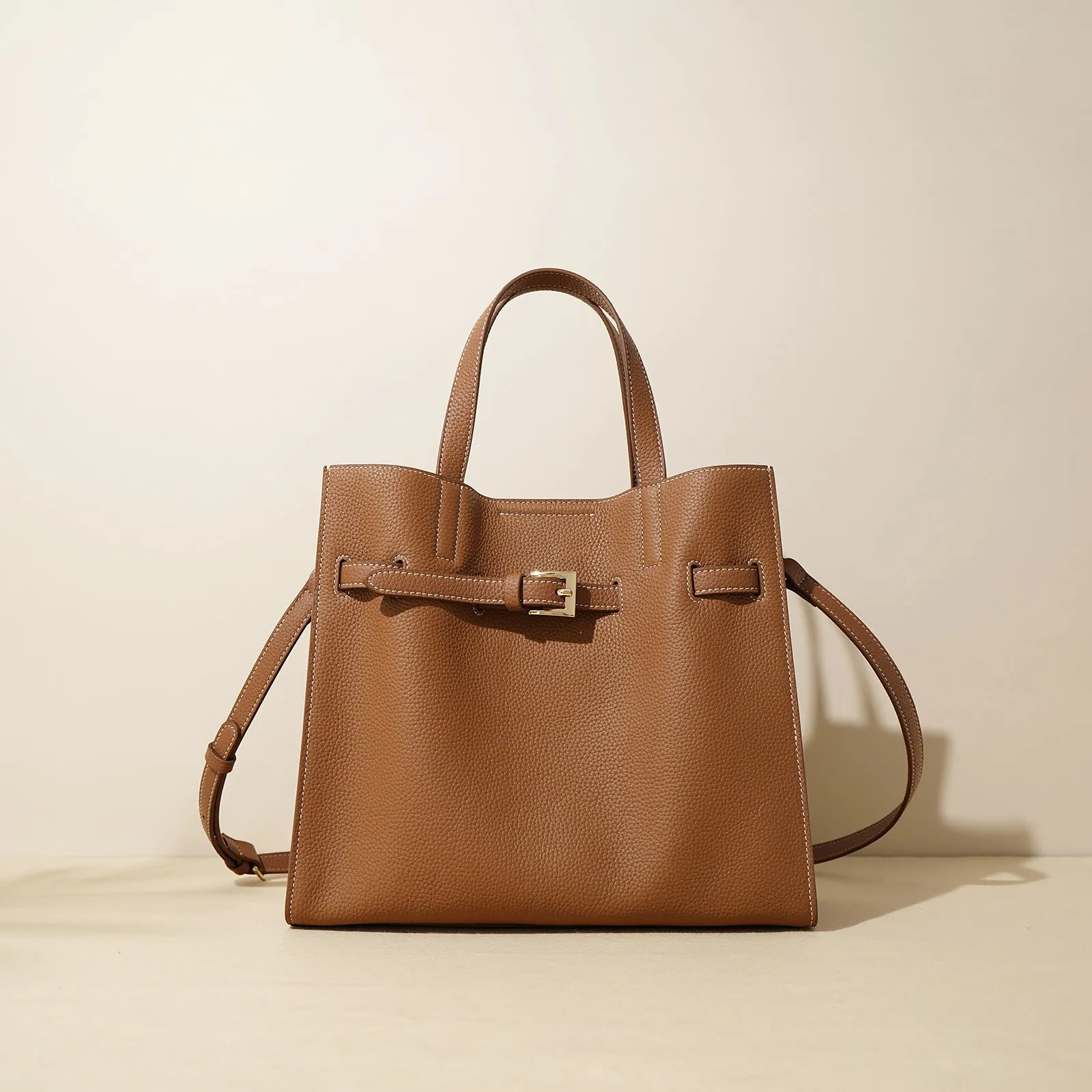 Genuine leather crossbody commuter bag in Toffee Gold with double shoulder straps and square vertical shape