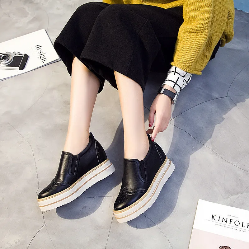 Women's genuine leather brogue platform shoes with metal detail and round toe in black