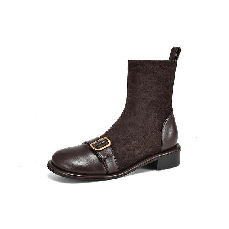 Women's black casual martin boots with belt buckle stitching, lace-up front, and a low rubber sole.