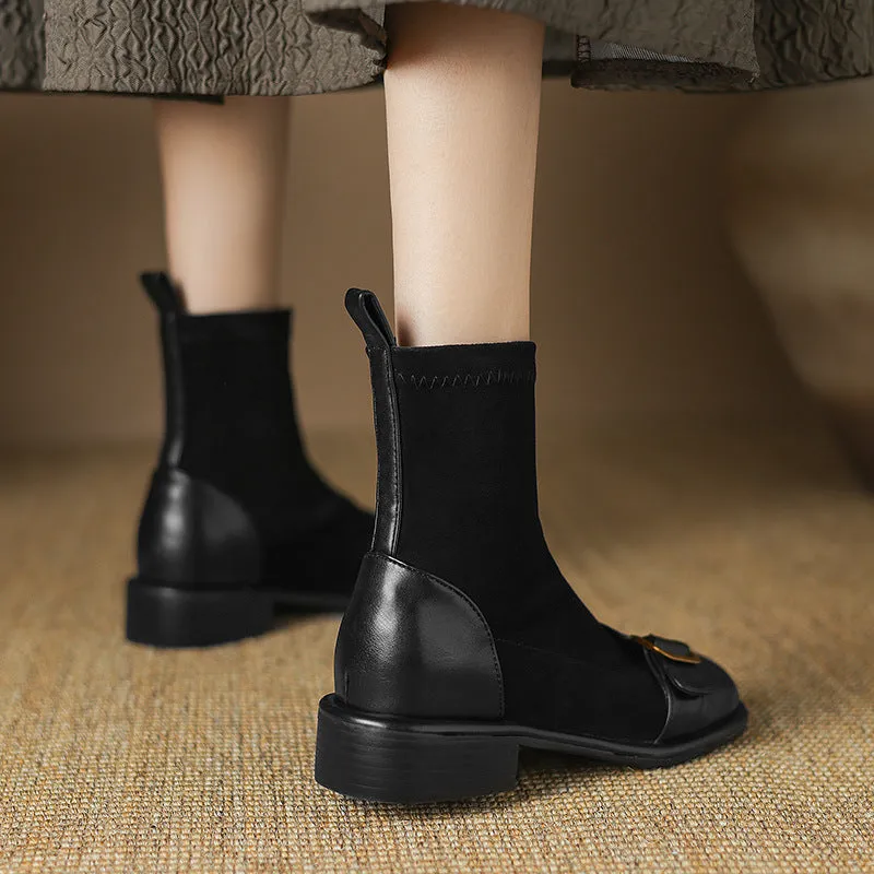 Women's black casual martin boots with belt buckle stitching, lace-up front, and a low rubber sole.