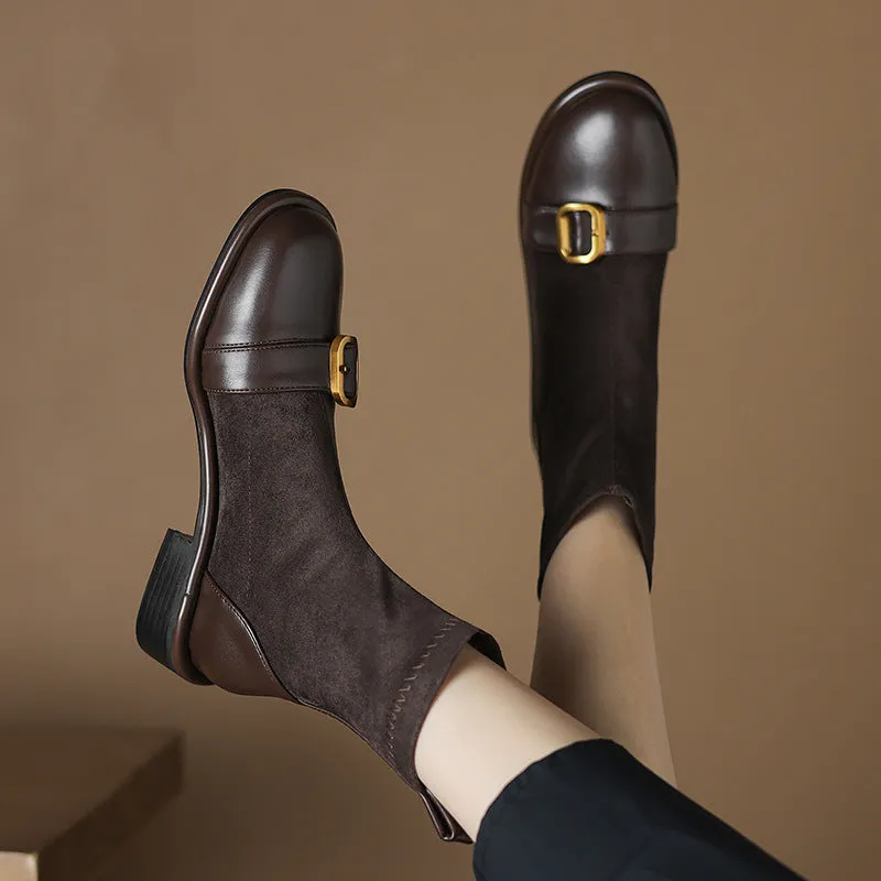 Women's black casual martin boots with belt buckle stitching, lace-up front, and a low rubber sole.