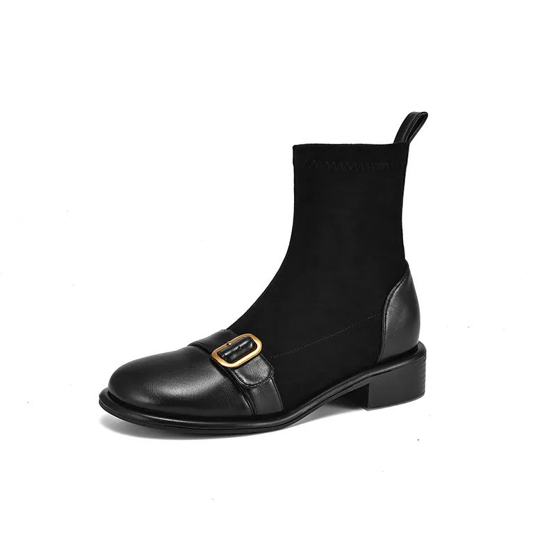 Women's black casual martin boots with belt buckle stitching, lace-up front, and a low rubber sole.