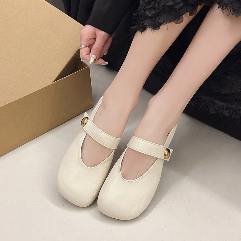 Women's casual flat heel buckle pumps in black with round toe and belt buckle detail