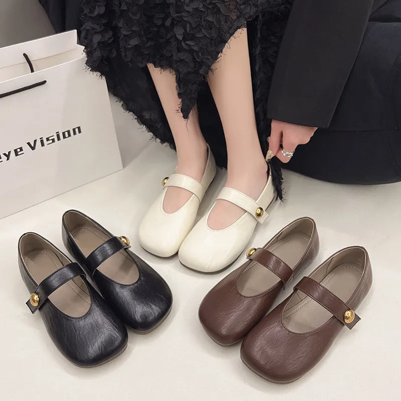 Women's casual flat heel buckle pumps in black with round toe and belt buckle detail
