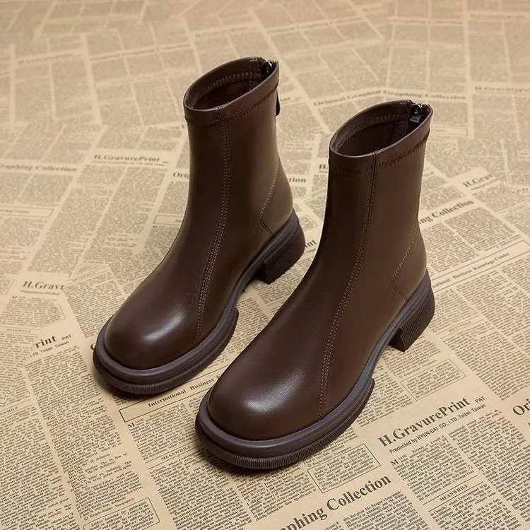 Women's black flat heel ankle boots with back zipper and round toe design