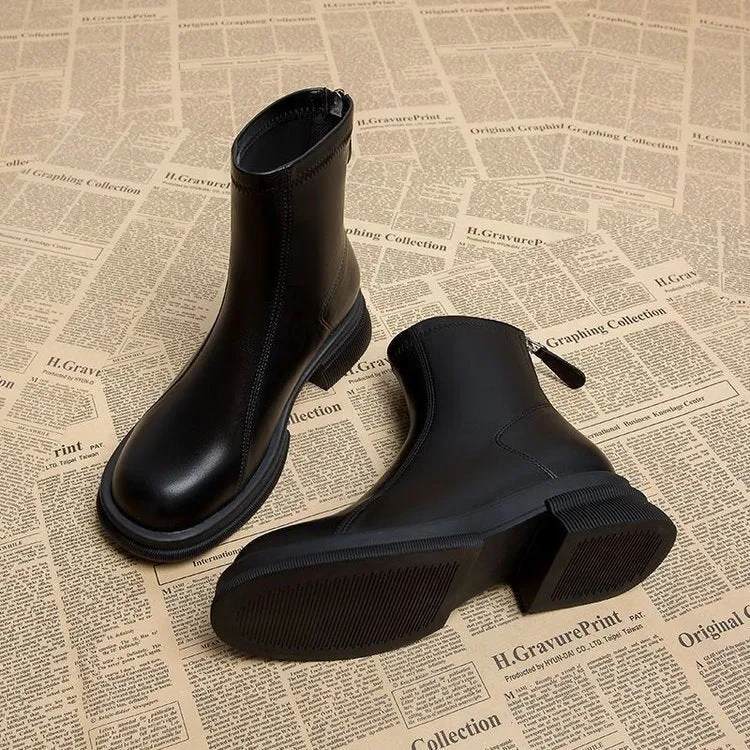 Women's black flat heel ankle boots with back zipper and round toe design