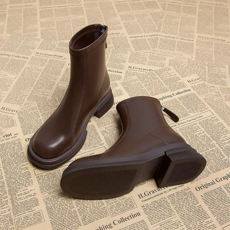 Women's black flat heel ankle boots with back zipper and round toe design