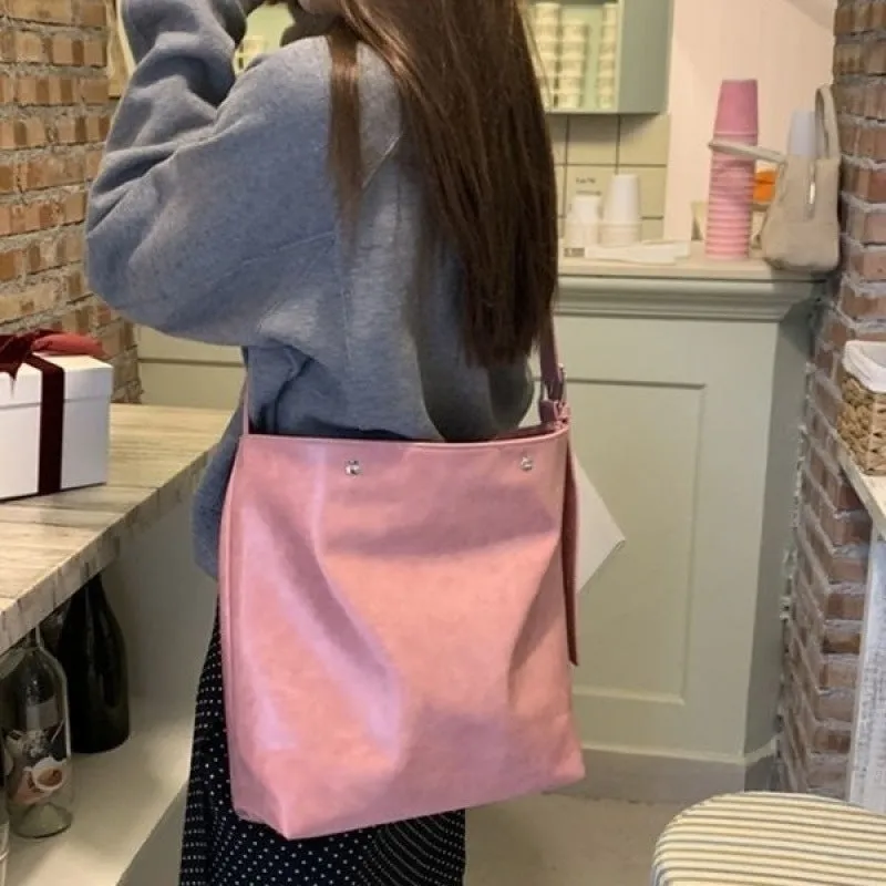 Corduroy one-shoulder bag in pink or brown showing dimensions and PU lining interior