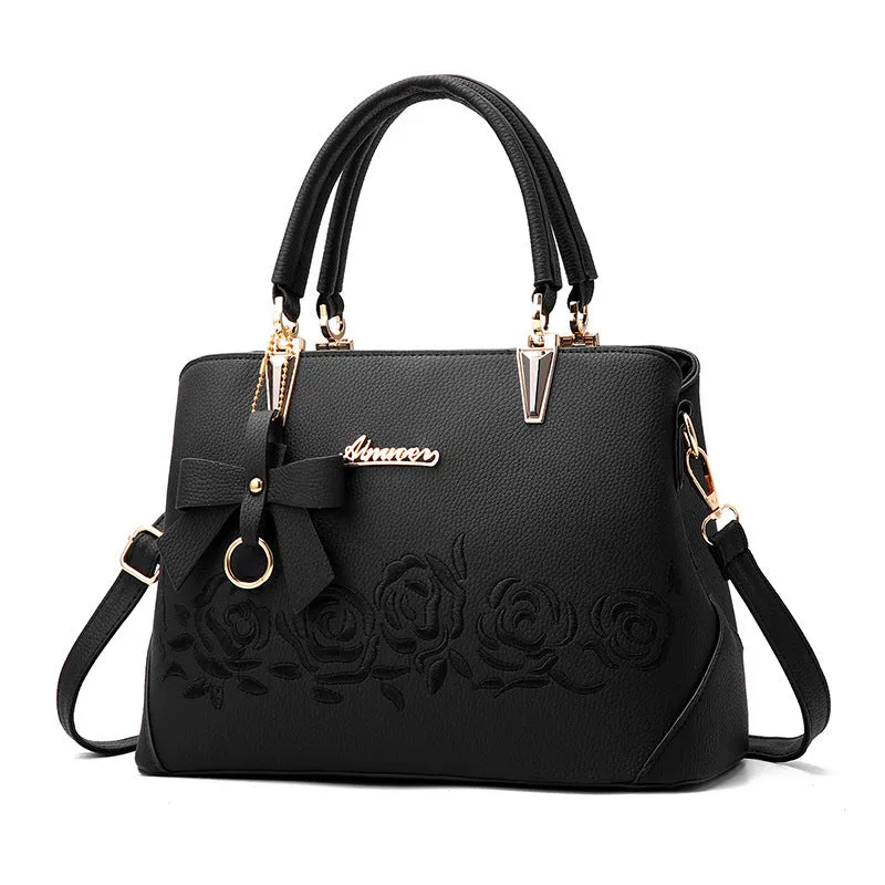 Women's large leather messenger bag with tassel and embroidery in wine red colour