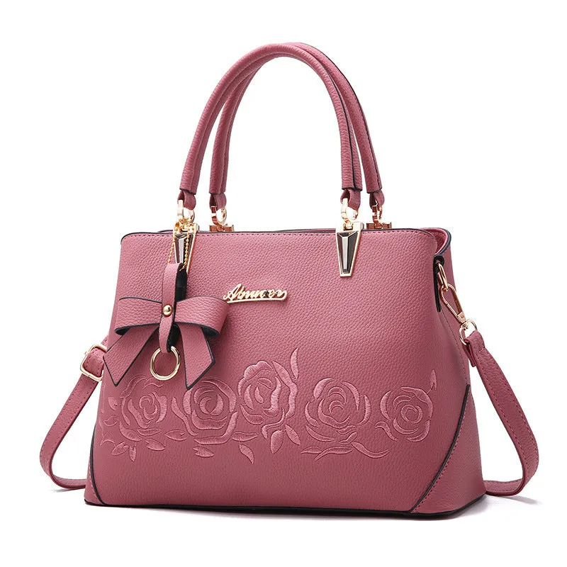Women's large leather messenger bag with tassel and embroidery in wine red colour