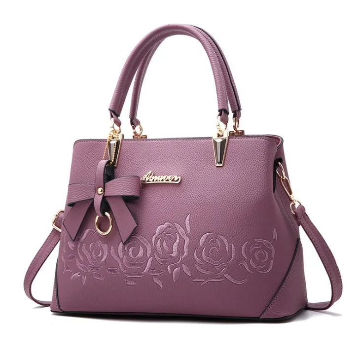Women's large leather messenger bag with tassel and embroidery in wine red colour