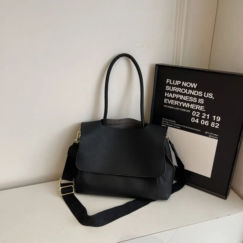 Vintage style square tote bag in PU leather-look material with visible stitching detail.