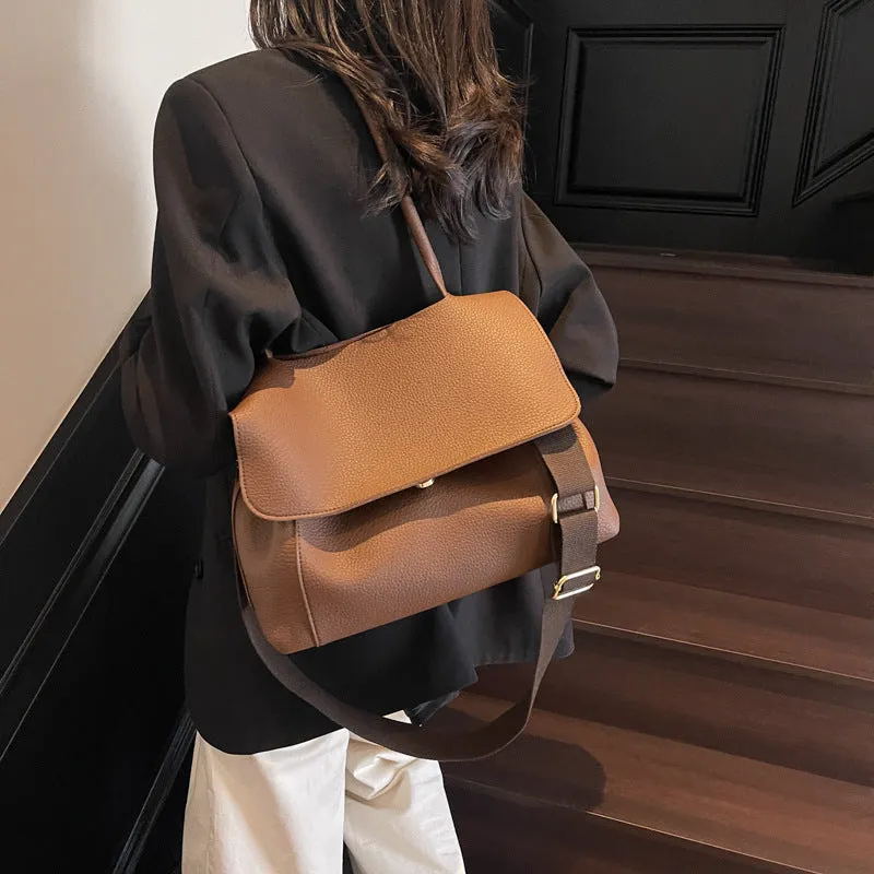 Vintage style square tote bag in PU leather-look material with visible stitching detail.