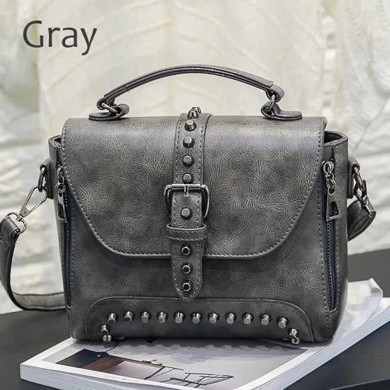 Vintage leather crossbody handbag with flap pocket and rivet detail in brown, size 25x20x12cm
