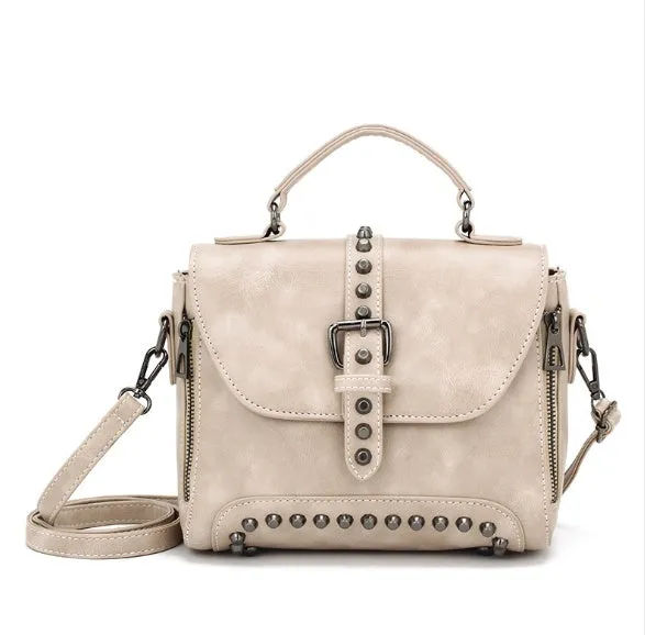 Vintage leather crossbody handbag with flap pocket and rivet detail in brown, size 25x20x12cm