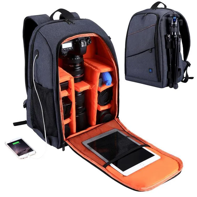 Black cotton outdoor photography mountaineering bag 20L with straps on a rocky hiking trail