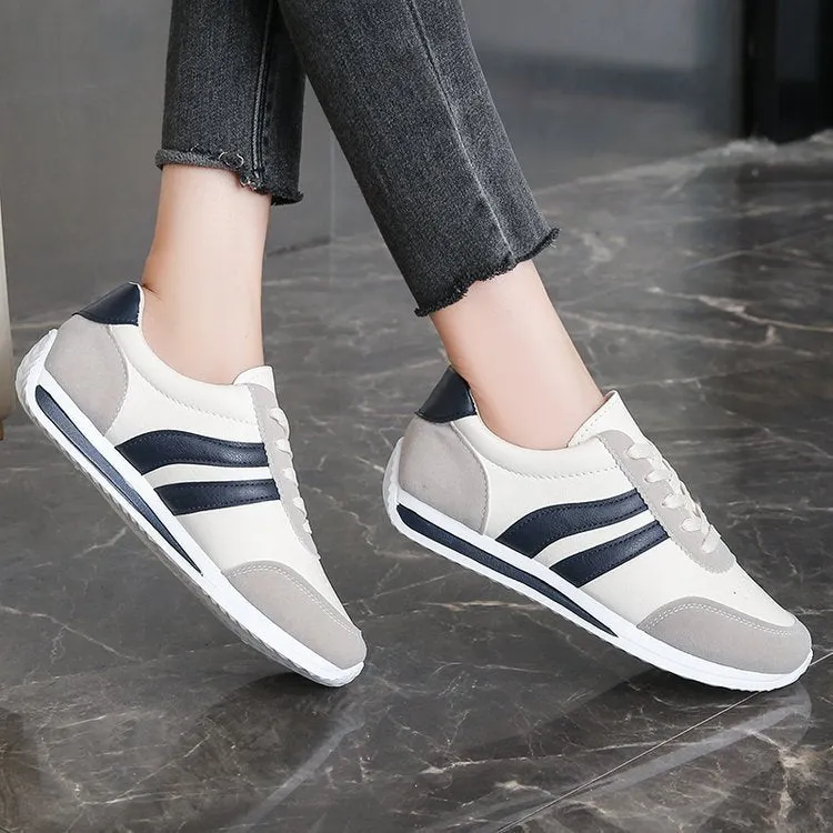 Red and blue lace-up sneakers with soft rubber soles and PU mesh upper