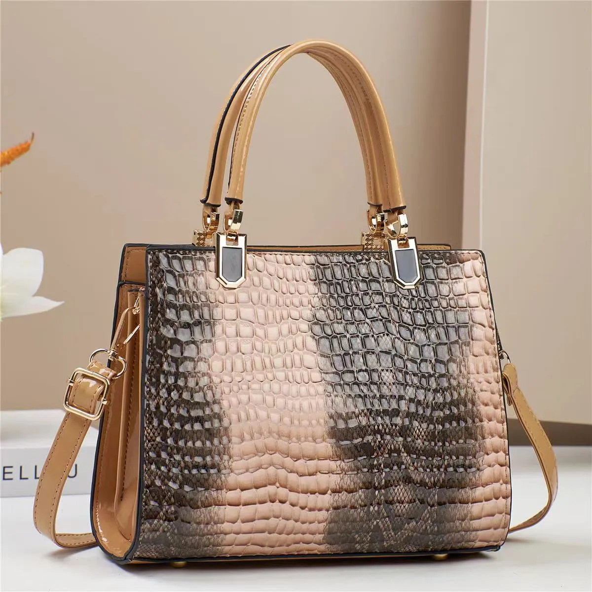 Women's soft PU one shoulder handbag showing multiple internal zip compartments and neutral colour option