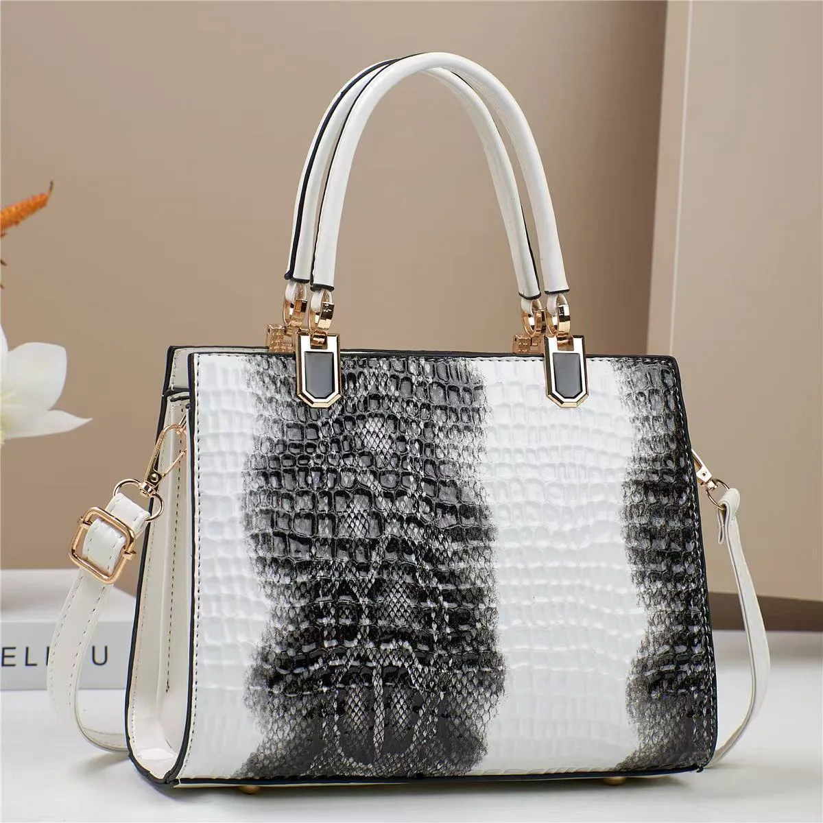 Women's soft PU one shoulder handbag showing multiple internal zip compartments and neutral colour option