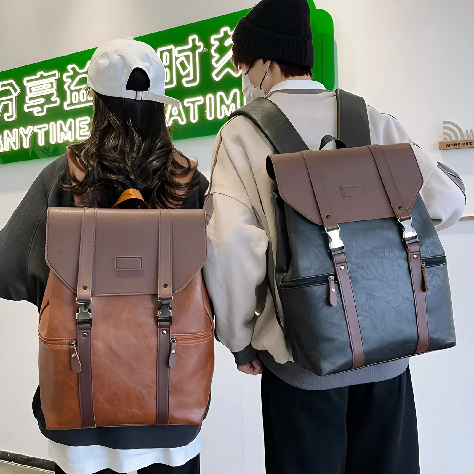 Large capacity PU leather schoolbag with flip closure, black colour, curved shoulder straps, side view