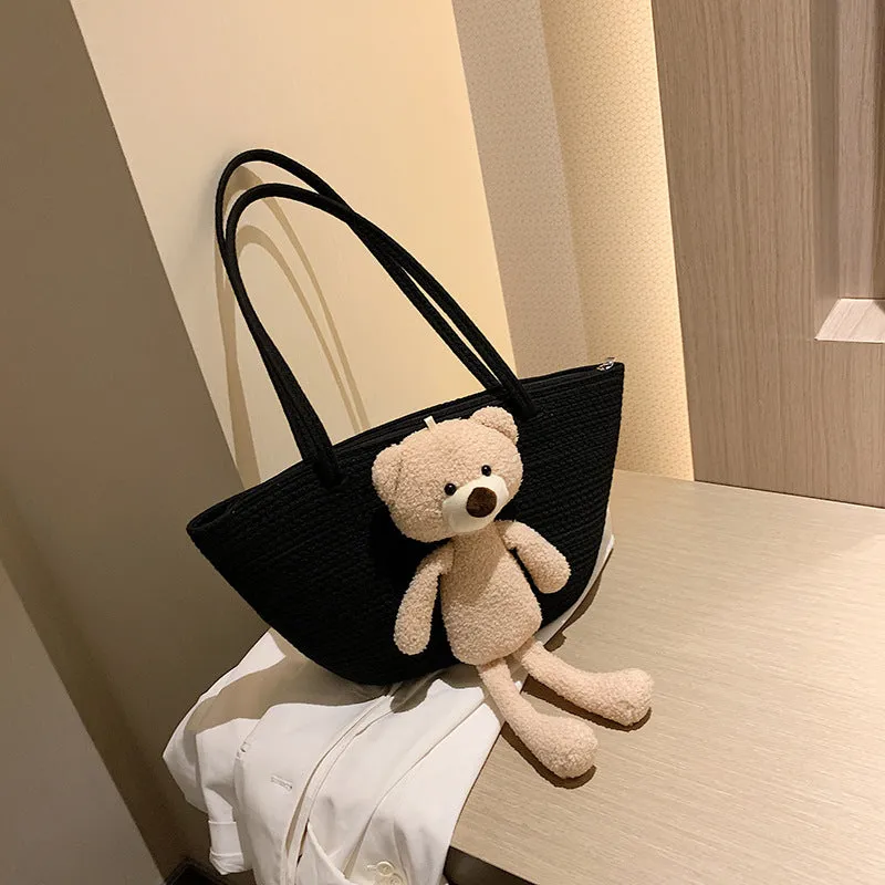 Woven cotton linen tote bag with dumpling shape, double shoulder straps, and an external pocket in one of six colours.