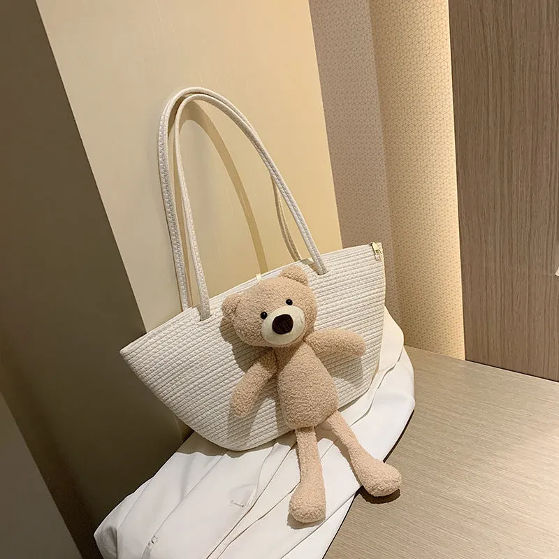 Woven cotton linen tote bag with dumpling shape, double shoulder straps, and an external pocket in one of six colours.