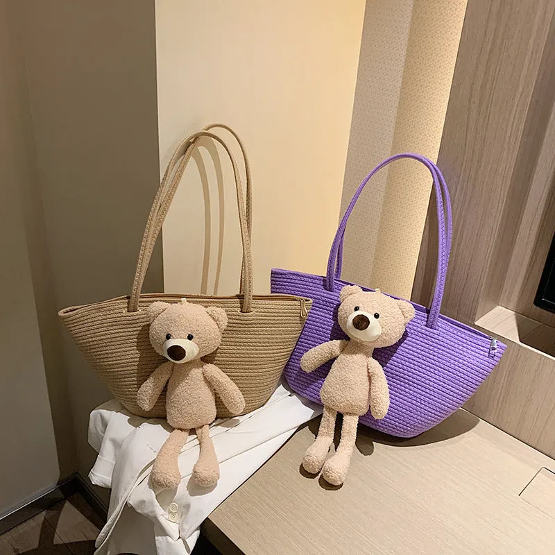 Woven cotton linen tote bag with dumpling shape, double shoulder straps, and an external pocket in one of six colours.