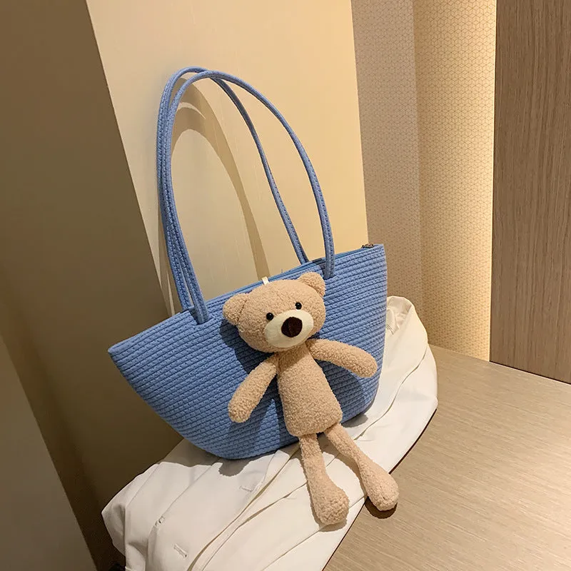 Woven cotton linen tote bag with dumpling shape, double shoulder straps, and an external pocket in one of six colours.