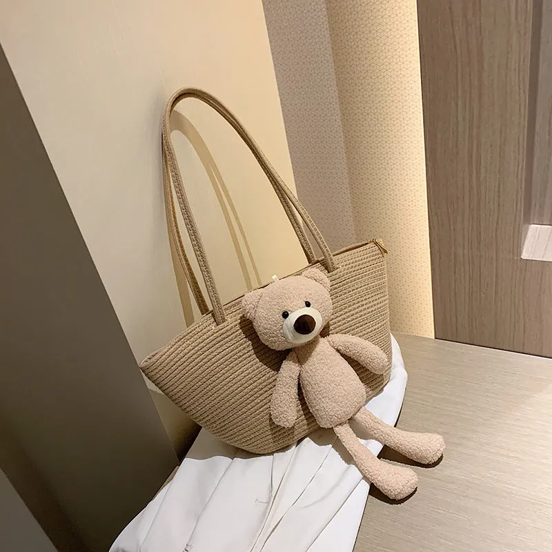 Woven cotton linen tote bag with dumpling shape, double shoulder straps, and an external pocket in one of six colours.