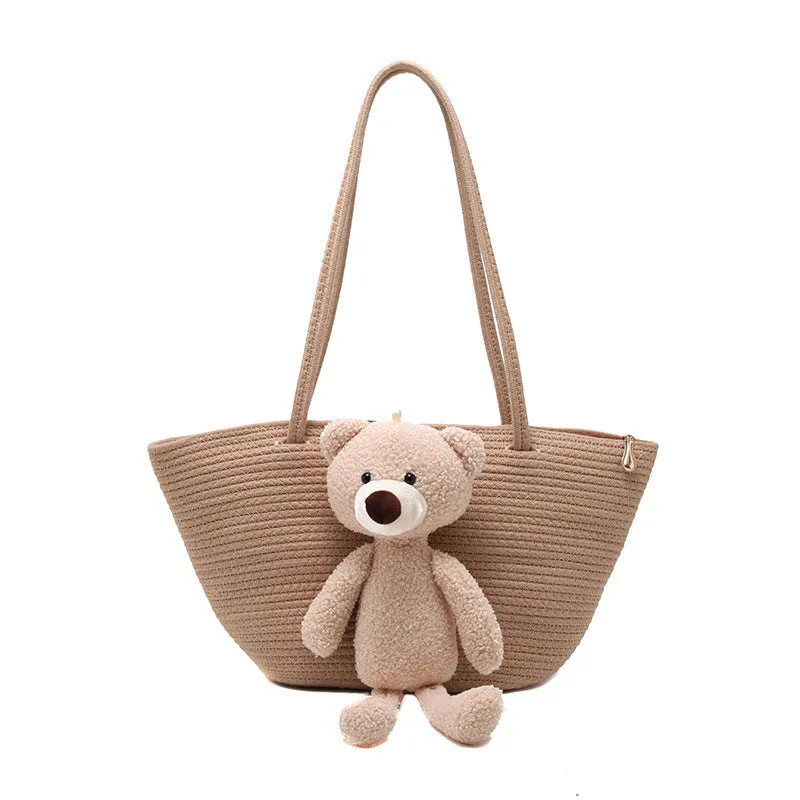 Woven cotton linen tote bag with dumpling shape, double shoulder straps, and an external pocket in one of six colours.