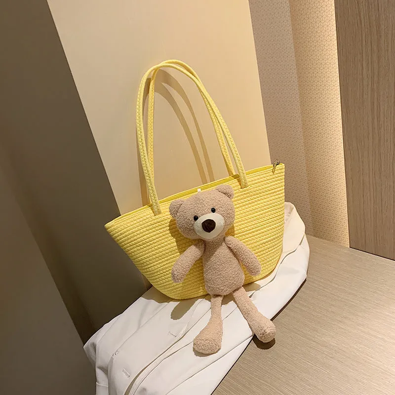 Woven cotton linen tote bag with dumpling shape, double shoulder straps, and an external pocket in one of six colours.