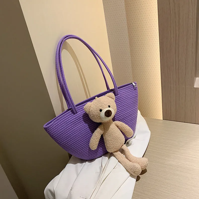 Woven cotton linen tote bag with dumpling shape, double shoulder straps, and an external pocket in one of six colours.