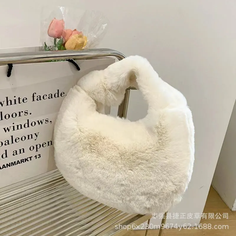 Plush dumpling bag in apricot colour, soft textured handheld handbag with polyester lining