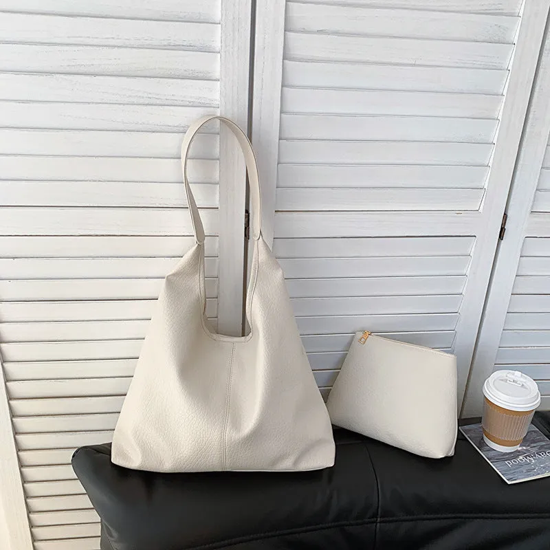 Women's large capacity soft PU shoulder bucket bag with contrast stitching in silver, front view