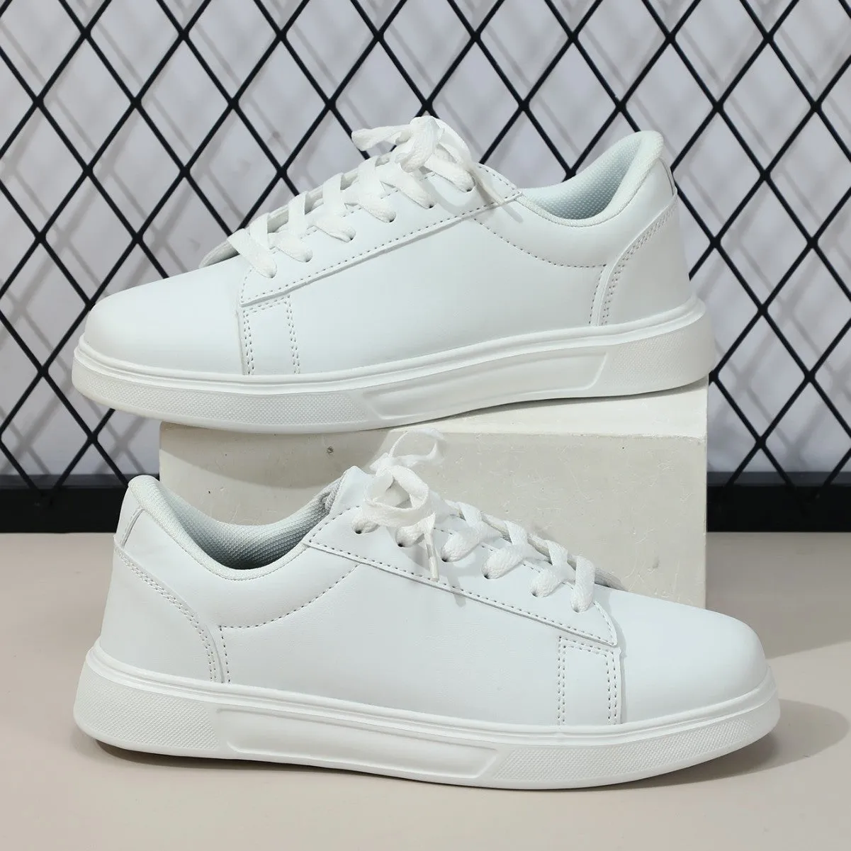 Beige brown platform skateboard sneakers with a cross-strap and round toe on a white background.
