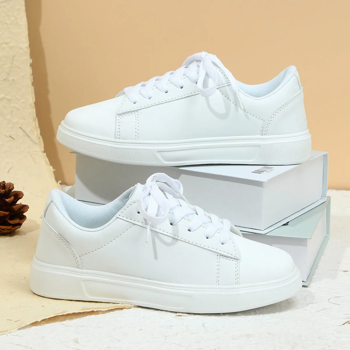 Beige brown platform skateboard sneakers with a cross-strap and round toe on a white background.